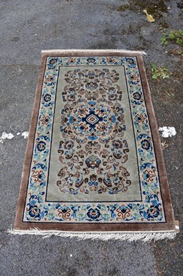 Lot 1494 - A Chinese part silk tapestry carpet with...
