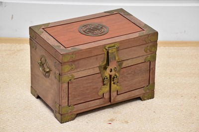 Lot 2623 - A Chinese hardwood and brass mounted trinket...