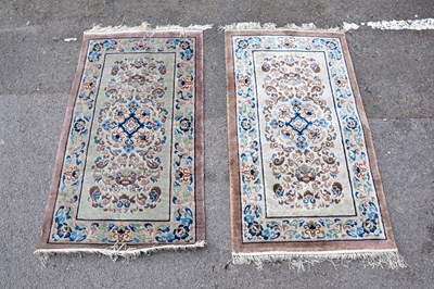 Lot 1486 - A pair of Chinese hand knotted part silk...