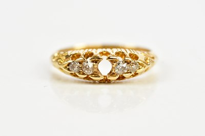 Lot 334 - An 18ct gold ring set with four diamonds, size...