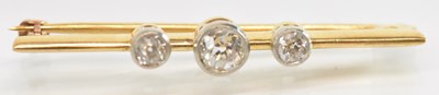 Lot 1247 - A yellow metal diamond set bar brooch, the...