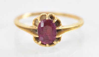 Lot 1289 - A yellow metal ruby set ring, the central ruby...