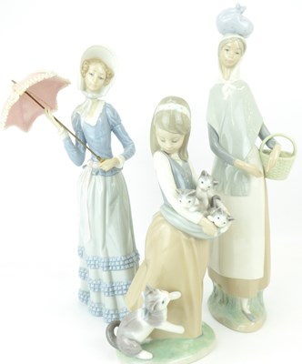 Lot 335 - LLADRÓ; three porcelain figures comprising a...