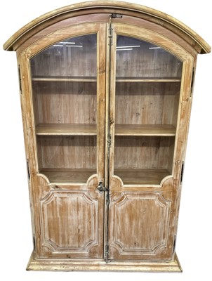 Lot 34 - A large modern limed oak two door display...