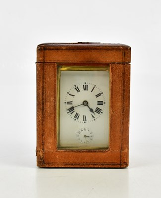 Lot 1427 - A brass cased carriage clock with white enamel...
