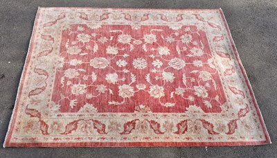 Lot 1426 - A Persian wool rug decorated with an all over...