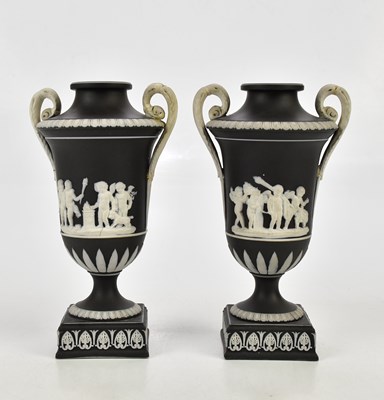 Lot 2490 - WEDGWOOD; a pair of black jasperware twin...