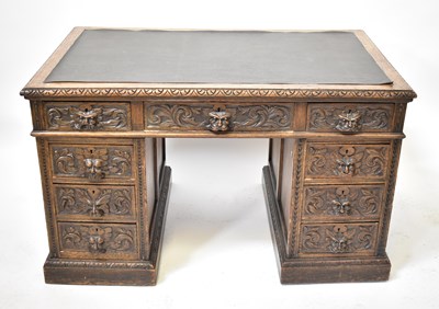 Lot 22 - An early 20th century carved oak nine-drawer...
