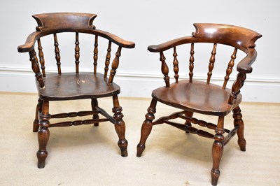 Lot 1375 - Two elm seated smoker's bow back elbow chairs...