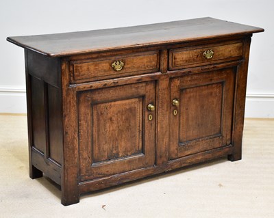 Lot 1368 - An 18th century oak dresser base with two...