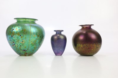 Lot 2575 - Three contemporary iridescent art glass vases...