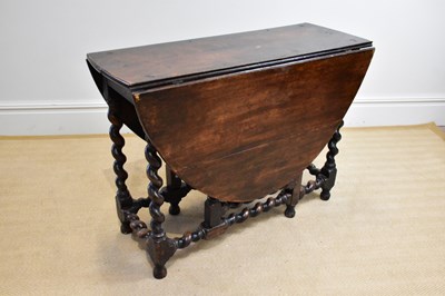 Lot 1166 - An 18th century and later oak drop-leaf...