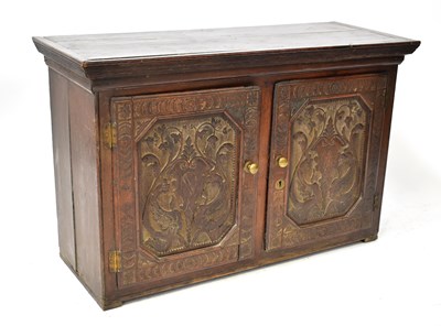 Lot 57 - An 18th century oak cupboard top with blind...