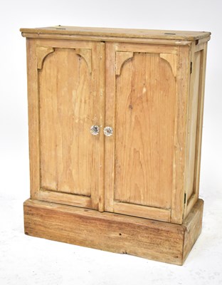 Lot 28 - An early 20th century pine miniature wardrobe,...