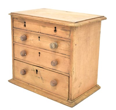 Lot 390 - An early 20th century pine money bank in the...