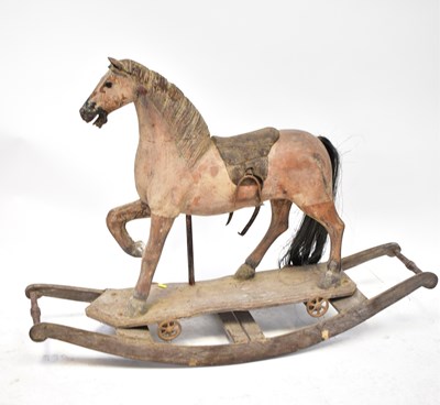 Lot 688 - A 20th century wooden rocking horse with...