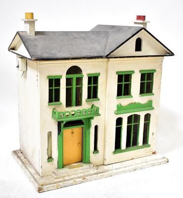 Lot 690 - A vintage wooden dolls' house with a small...