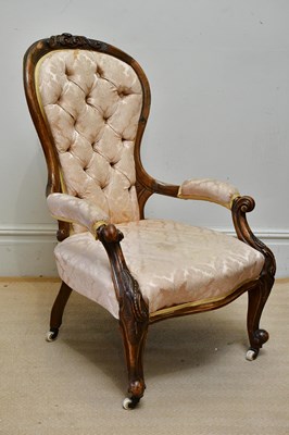Lot 1085 - A Victorian walnut spoon back open armchair,...