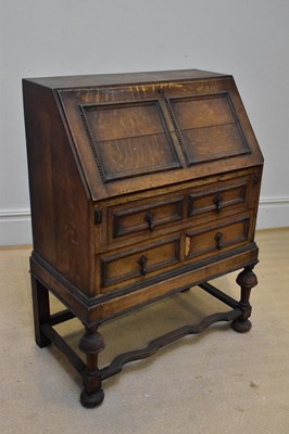 Lot 1332 - An early 20th century oak bureau, the fall...