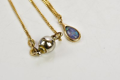 Lot 289 - A 9ct gold flat link chain supporting a pear...