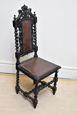 Lot 1346 - A 19th century carved oak hall chair with...