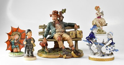 Lot 152 - CAPODIMONTE; a figure of a man sitting on a...