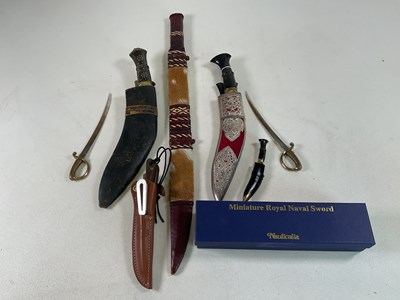Lot 21 - A Gurkha's kukri knife with silvered metal...