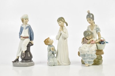 Lot 2535 - LLADRO; a figure of a maiden with a boy and...