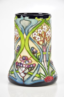 Lot 2331 - MOORCROFT; an elephant's foot shaped vase with...