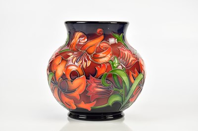 Lot 2286 - MOORCROFT; a baluster shaped vase with floral...