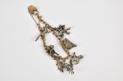 Lot 447 - A yellow metal charm bracelet with padlock...