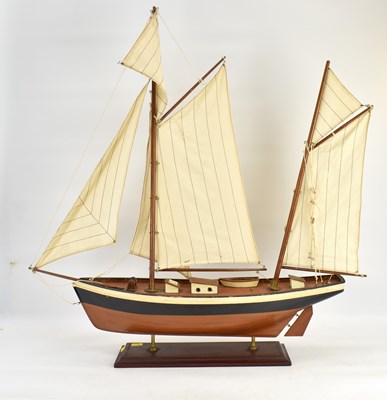 Lot 384 - A wooden model of a two-masted yacht, with...