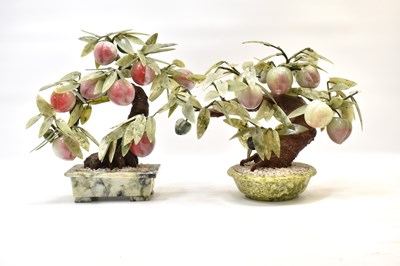 Lot 154 - Two Oriental carved hardwood fruit trees in...