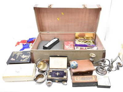 Lot 377 - A vintage suitcase containing various mixed...
