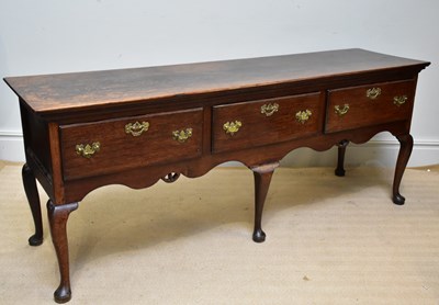 Lot 1364 - A late 18th century oak three drawer dresser...