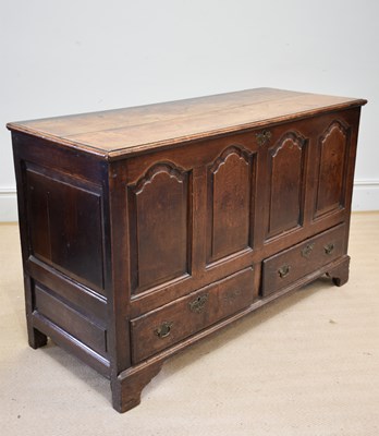 Lot 1157 - A late 18th century oak coffer, the hinged lid...