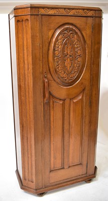 Lot 27 - An early 20th century oak hall robe with...