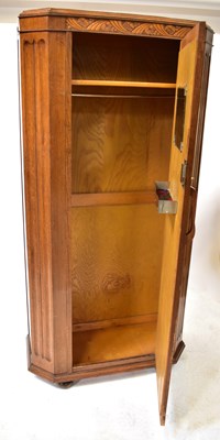 Lot 27 - An early 20th century oak hall robe with...