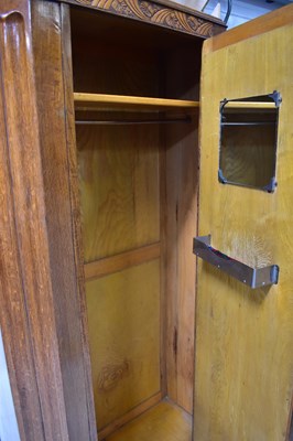 Lot 27 - An early 20th century oak hall robe with...