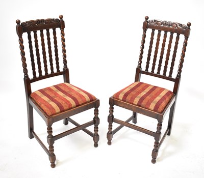 Lot 33 - A set of four early 20th century oak dining...