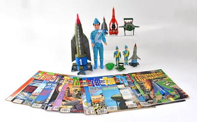 Lot 634 - THUNDERBIRDS; various toys and books relating...