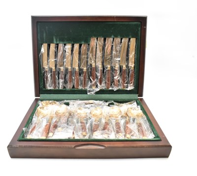 Lot 386 - A wooden cased canteen of cutlery, the...