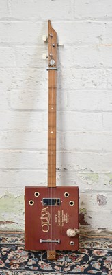 Lot 1584 - A scratch built three string cigar box guitar.
