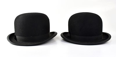 Lot 477 - A vintage leatherette hat box containing two...