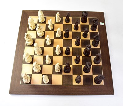 Lot 636 - A contemporary Chinese resin chess set and an...