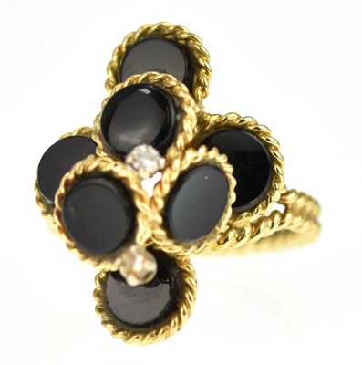 Lot 1012 - An 18ct gold contemporary ring with six black...