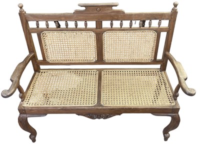 Lot 33 - A mahogany bergère settee on cabriole legs.