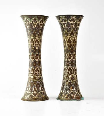 Lot 366 - A pair of Indian painted brass trumpet-form...