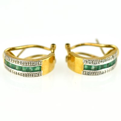 Lot 1101 - A pair of 9ct gold emerald and diamond set...