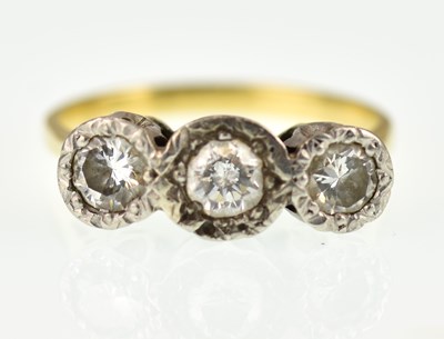 Lot 996 - An 18ct gold three-stone diamond ring, the...